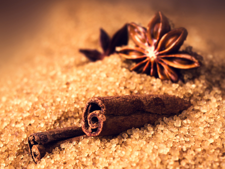Cinnamon sticks and star anise on brown sugar macroの写真素材