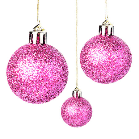 Christmas ornaments with shiny festive baubles hanging Isolated on white backgroundの写真素材
