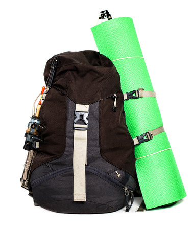 Large touristic backpack with lightweight foam mat  isolated on white background, close up.の写真素材