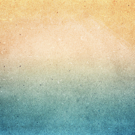  Summer beach recycled paper textured background with film grain. Abstract sea beach recycled paper texture. Water color on recycle blue and yellow.の写真素材