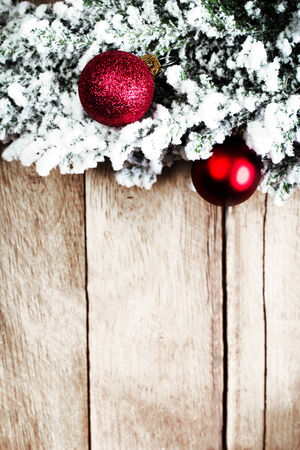 Christmas fir tree with decoration on a wooden board. Christmas rustic  vintage planked wood with free text spaceの写真素材