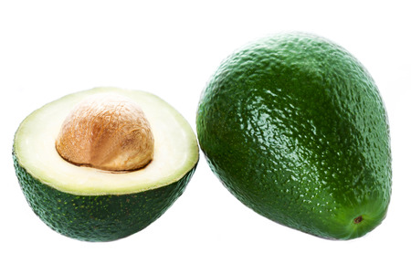 Avocado slice and whole ripe green avocado fruit  isolated on a white background.