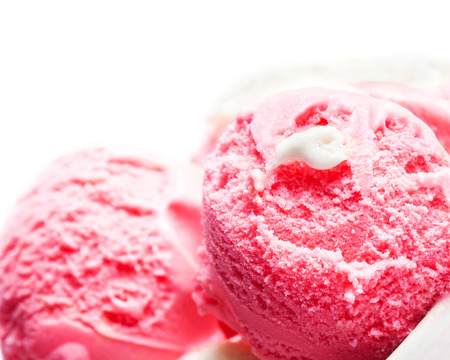 Strawberry Ice Cream isolated over white background. Macro. Beautiful Ice-Cream Balls close up with copyspace for text.の写真素材