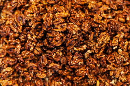 Walnut kernels  background on a market stall close-up. Food healthy backdrop