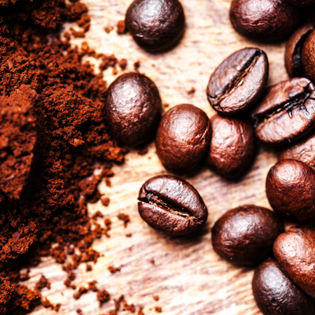 Coffee beans on grunge wooden table top view image, macroの写真素材