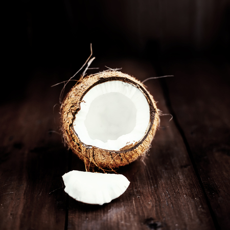 close up of a coconut on a wooden background with copy spaceの写真素材