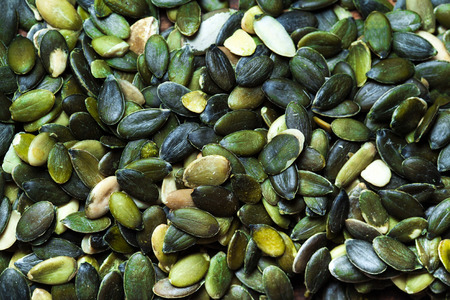 Pumpkin seeds background top view imageの写真素材