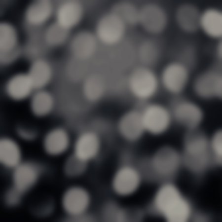 Black Abstract Christmas glitter vintage lights background. Dark Night Glitter defocused wallpaper with sparkling bokehの写真素材