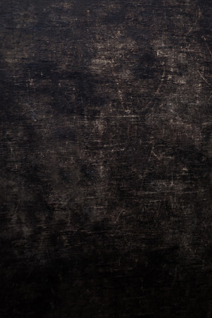 Dark scratched grunge wooden board. Black Wood texture.の写真素材
