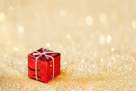 Christmas decoration on abstract bokeh background. Merry christmas and Happy New Year Card. Red gift...