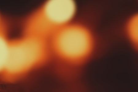 Abstract Christmas background with 	glitter vintage lights. Dark golden and black color.の写真素材