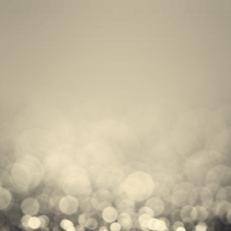 Beautiful Bokeh background with defocused lights. Blurry Abstract Festive background. Sparkling...