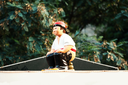 Barcelona, Spain - December 9, 2015: Christmas market items - the Caganer, typical catalan character. This represents someone defecating, Catalonia Christmas traditional symbolのeditorial素材