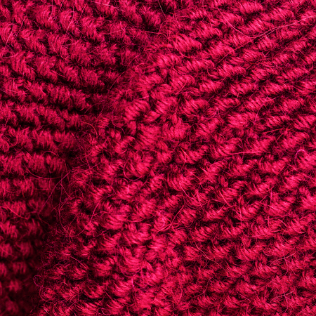 Red knitting wool texture background. Colorful knitted horizontal textured background.の写真素材