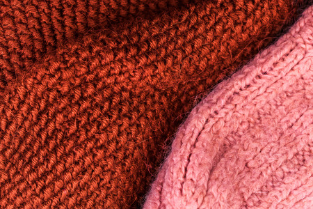 Red knitting wool texture background. Colorful knitted horizontal textured background