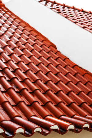 Red color  roof tiles isolated with copyspace の写真素材