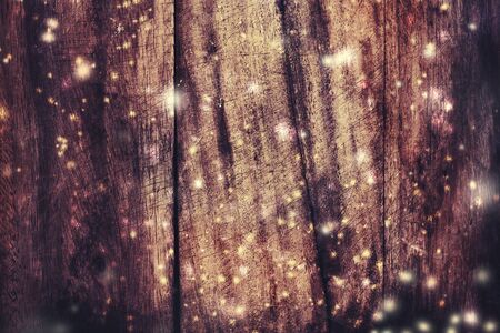 Christmas wooden background with falling snow. View with copy space
の写真素材