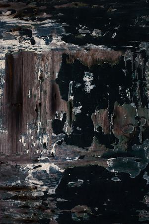 Weathered dark  wood as a background. Wooden textured wall scored and stained with age
の写真素材