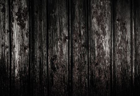 Black Natural old dirty wooden wall background with horizontal planks. Grunge wooden wall used as backdropの写真素材