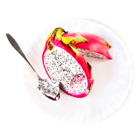 Dragon fruit cut in a half isolated on white background macroの写真素材