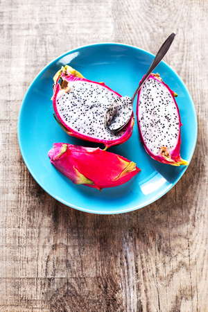 Dragon Fruit On old Wooden Table close upの写真素材