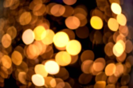Golden Festive abstract background with bokeh defocused lights and black shadow