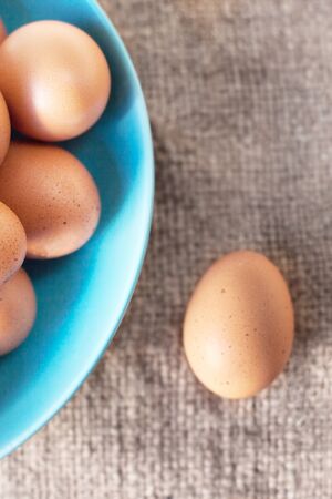 Eggs on wooden  background closeupの写真素材