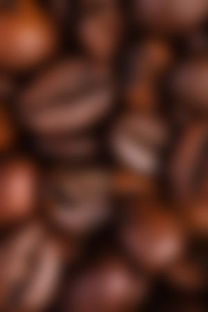 Defocused coffee beans Abstract brown background with warm sepia light color, blank web or template brochureの写真素材