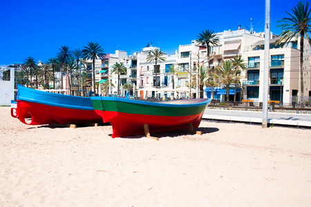 Catalonia, Spain - July 24, 2017: Beach sand, sea and boats in Badalona,  View of the beach with colorful art fishing boatsのeditorial素材
