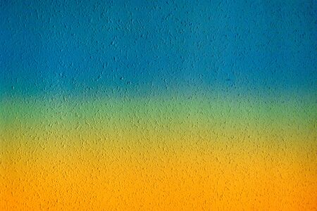 Abstract grunge summer concept  textured background with grain and scratches. Summer gradient wall in yellow and blue colorsの写真素材