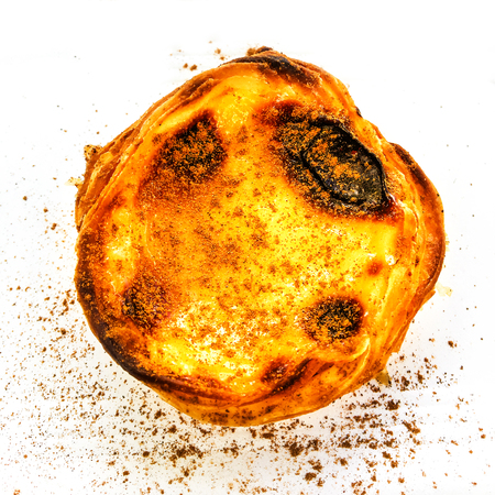 Egg tart or portuguese egg tart isolated on white background macro. Beautiful delicious freshly...