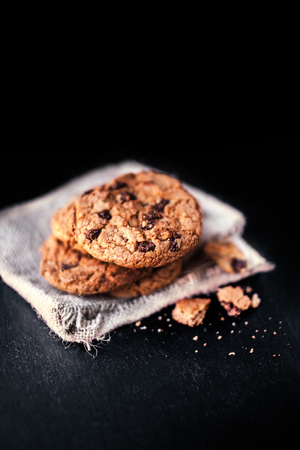 Chocolate chip cookies on dark  with place for text, freshly baked. Selective Focus with Copy space....