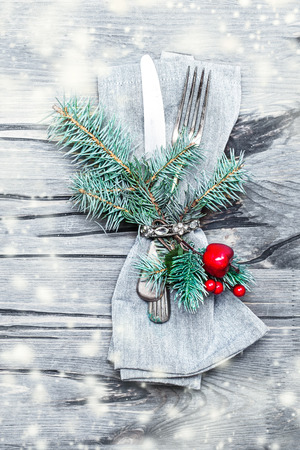 Beautiful Creative Christmas idea with table setting on bright wooden table. Christmas card with cutlery, copyspaceの写真素材