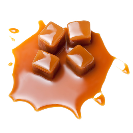 Caramel with sauce. Golden Butterscotch toffee candy caramels. Sweets  with copy space, macro.の写真素材