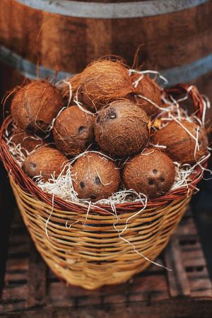 Pile of coconuts as  background. Organic coconuts  at  market in a basket. Harvesting concept. の写真素材