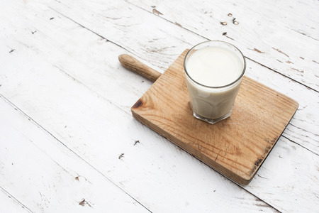 Glads of milk  on rustic white wooden table. Healthy breakfast, morning concept, copy spaceの写真素材