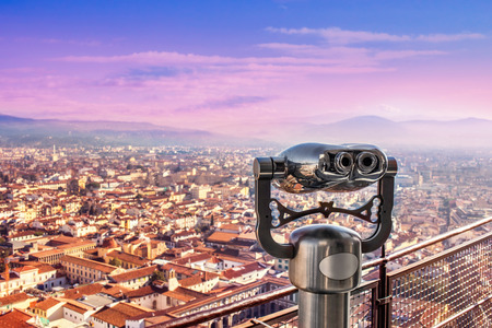 Amazing viewpoint with coin binoculars in Florence, Italy. Binoculars overlooking Florence bird view at beautiful sunset. Panorama of Florence
の写真素材