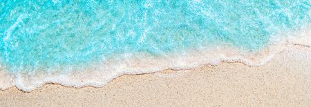 Soft wave of blue ocean on sandy beach with copy space fr text. Summer Background.