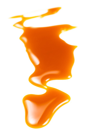 Sweet caramel sauce isolated on white background, top view. Flowing caramel
の写真素材