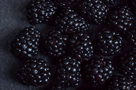 Blackberry Background. Closeup of fresh blackberries  on black textured  background with copy space.の写真素材