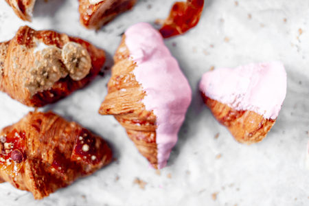 Croissants Background. Fresh homemade croissants with various toppings. Top view. Collection.