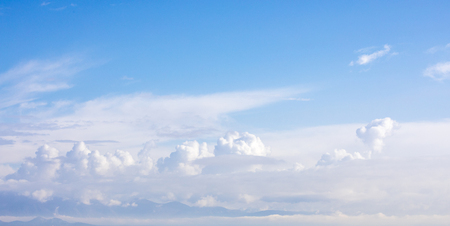 Blue sky background  with white fluffy  clouds. Copyspaceの写真素材