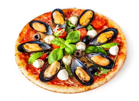 Seafood Pizza. Delisious Pissa with Mussels, tomatoes, cheese and basil leaf isolated on white background. Top view.の写真素材
