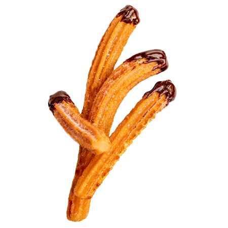 Churros - fried dough pastry with sugar and chocolate sauce dip isolated on a white background. Churro sticks, traditional Spanish snackの写真素材
