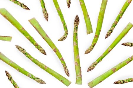 Asparagus Pattern. Creative layout made of fresh asparagus isolated on white background close up. Top viewの写真素材
