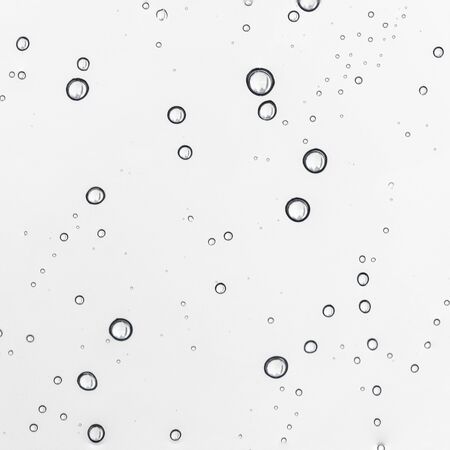 Rain water drops  on clear window.  Natural Pattern of raindrops. Autumn  depressive background.