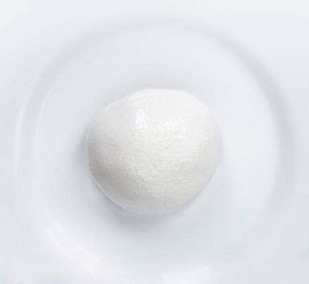 Mozzarella cheese Buffalo  isolated on a white plate. Top view. Traditional Italian Mozzarella