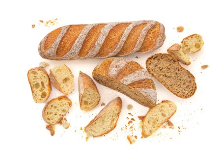 Sliced Multigrain rustic  bread isolated on a white background. Rye Bread with crusty loaves and crumbs. Top view. Flat lay. Bakery Food concept.の写真素材