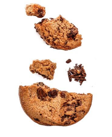 Chocolate butter  chip cookie isolated on white background.  Cookies broken in pieces with crumbs close up.
の写真素材