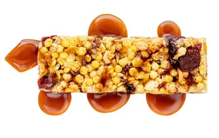 Granola bar with roasted nuts and caramel  isolated on white background. Muesli bar Top viewの写真素材
